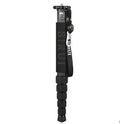 Black carbon fibre SLR camera monopod extended to maximum height with six visible sections