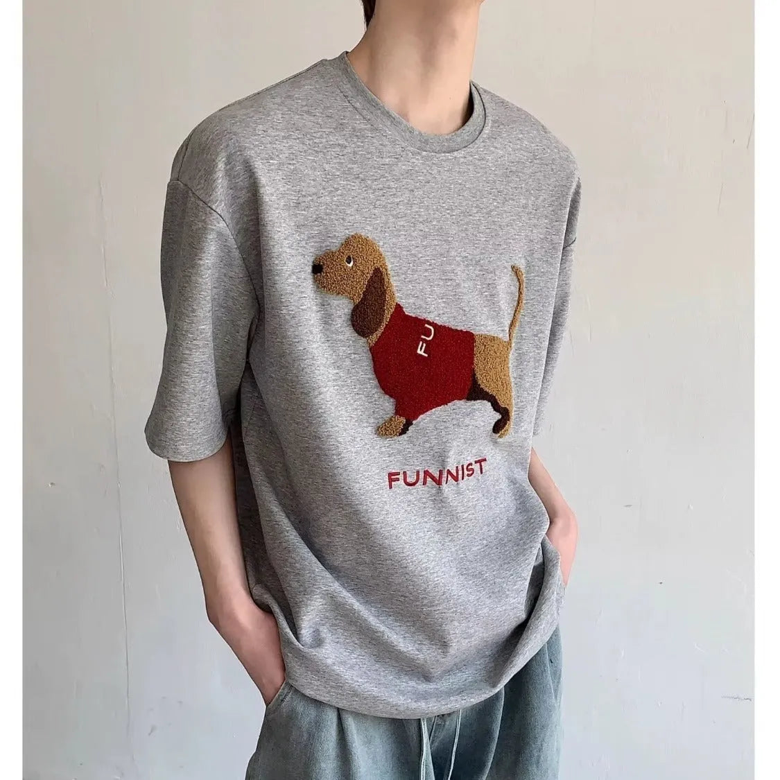 Men's grey cotton T-shirt with an embroidered sausage dog design on the front.