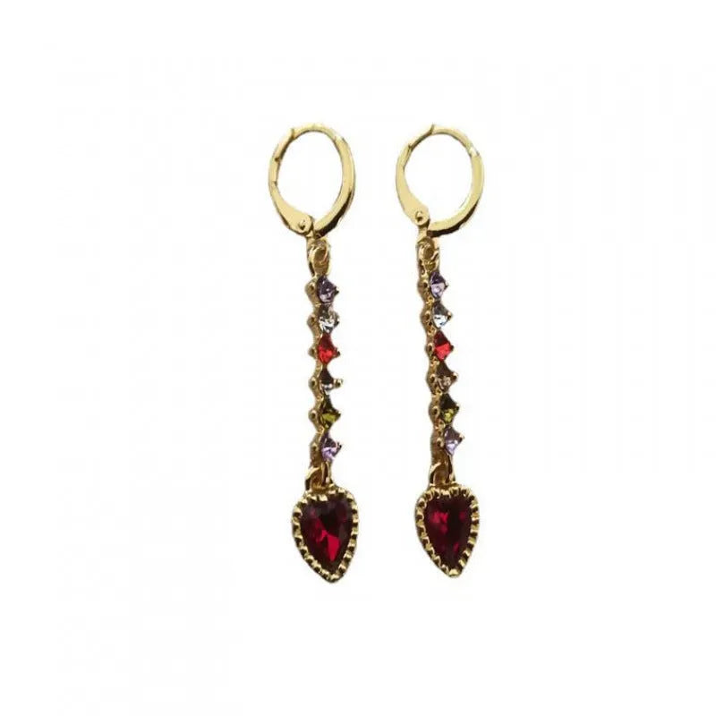 A pair of women's heart-shaped alloy earrings in a gold or silver electroplated colour.