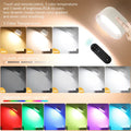 Oval white magnetic wall lamp with remote control showing colour changing functions