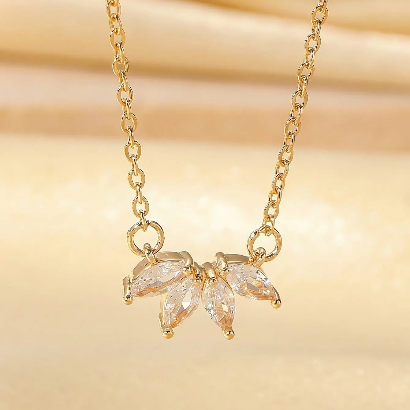 Rhinestone leaf necklace copper geometric pendant gold colour on display