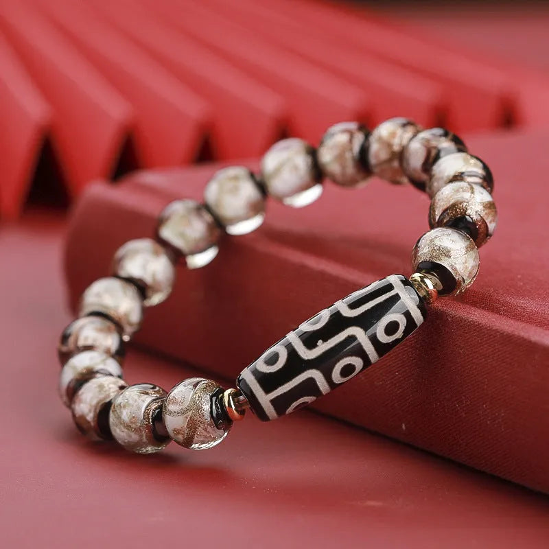 Chinese-style coloured glaze lucky bead bracelet with auspicious patterns for the Year of the Snake.