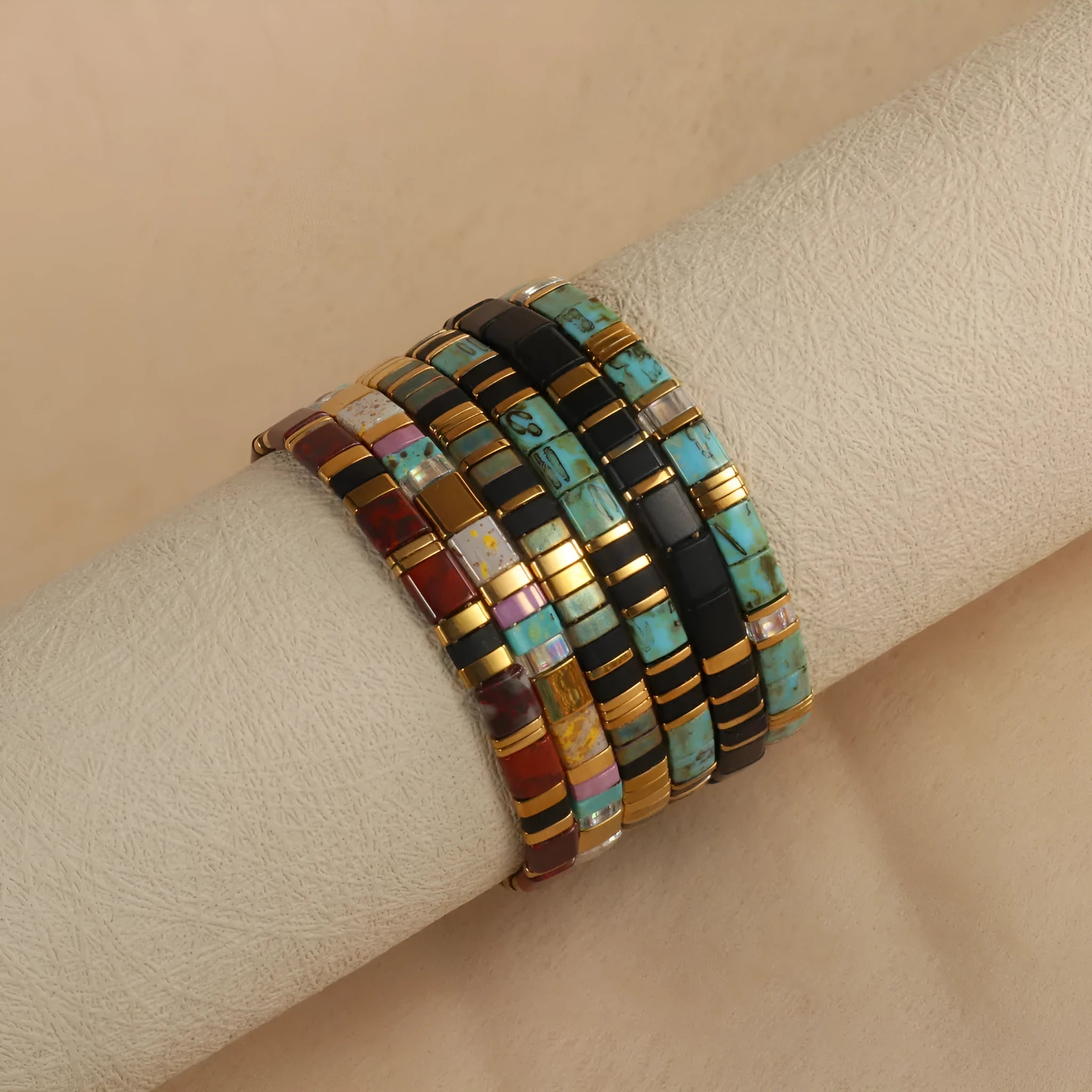 Geometric round glass bead bracelet in milky white, black, green, blue, or red.