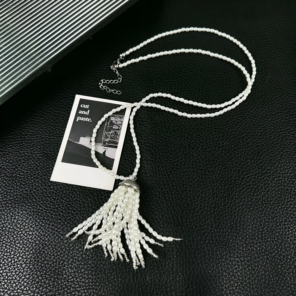 Women's pearl tassel necklace with long rice imitation pearl pendant and electroplated chain