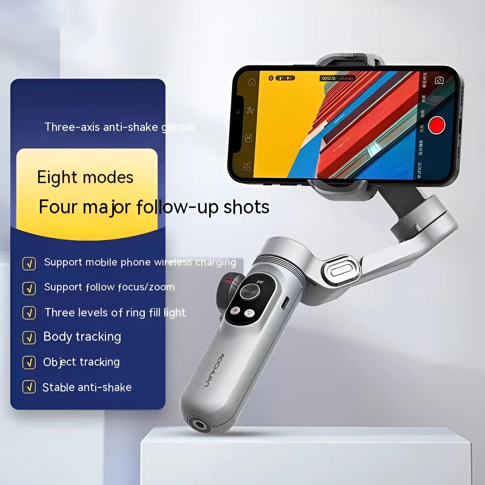 Silver grey smartphone gimbal stabiliser with extended arms and Bluetooth remote control on a table.