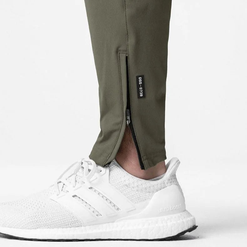 Men's grey ankle-tied running trousers for fitness exercise with quick-dry polyester fabric
