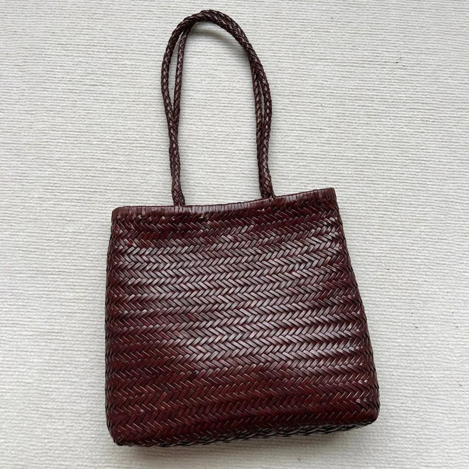 Brown woven tote shoulder bag with three-dimensional pocket made from first layer cowhide leather