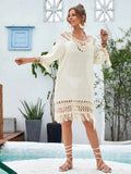 Apricot hand-crocheted long beach dress for women on a beach
