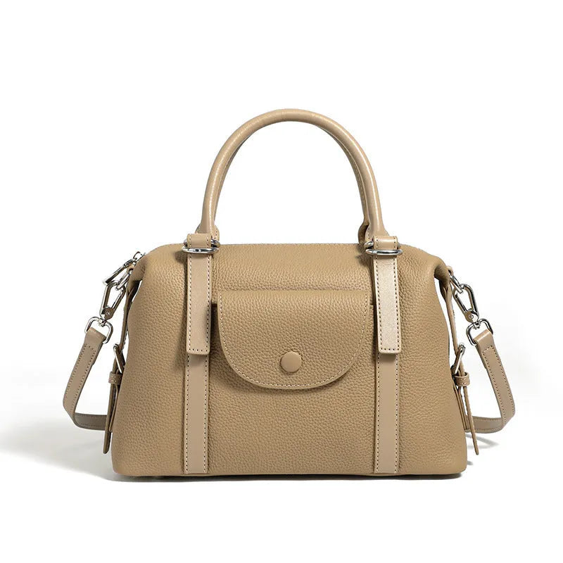 Genuine leather street trend handbag with lock detail and contrast stitching in 27x12x20 cm size