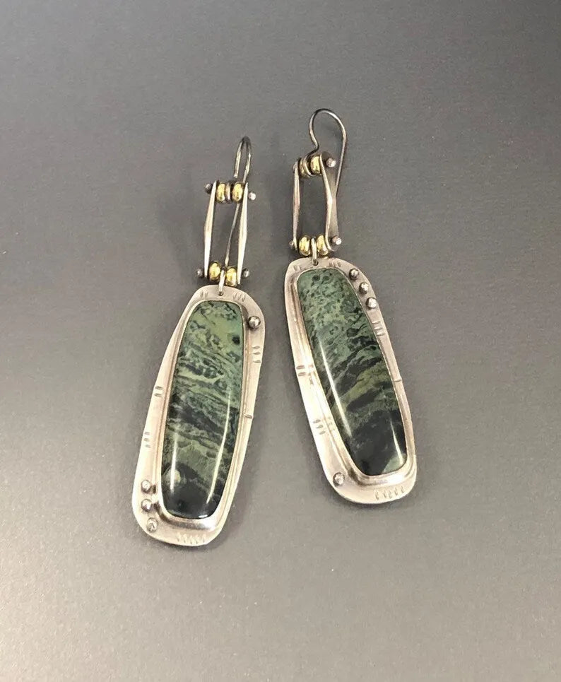 Geometric two-colour marble pattern alloy earrings with minimalist stud design