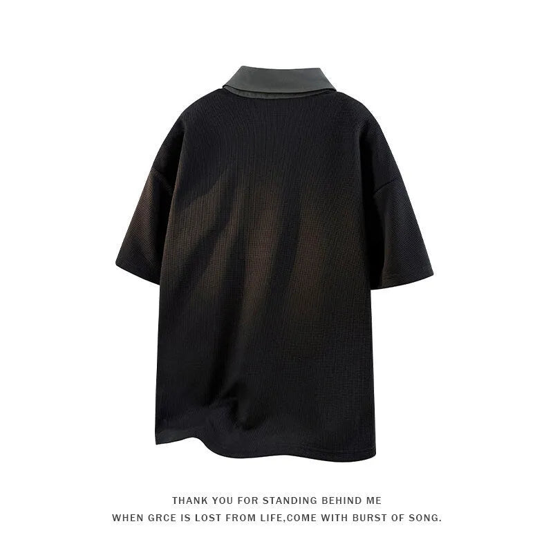 Men's black padded henry collar polo shirt made from spandex fabric, showing short sleeves and pullover style.