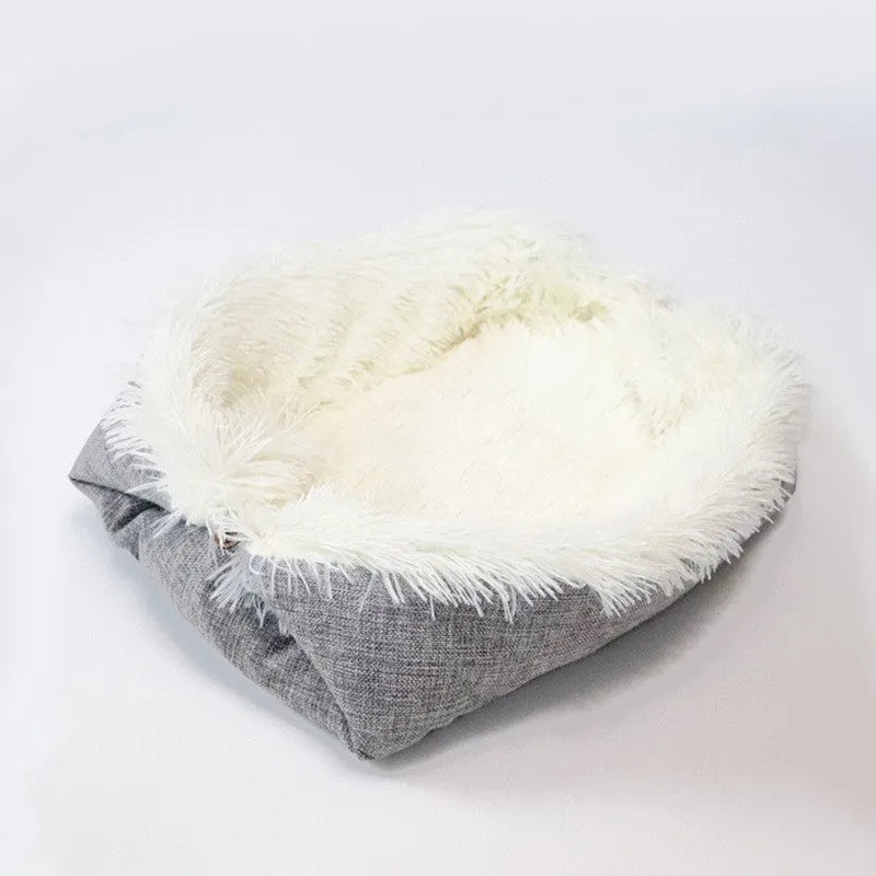 Grey or white pet blanket with long plush hair measuring 61cm by 51cm with non-slip black bottom