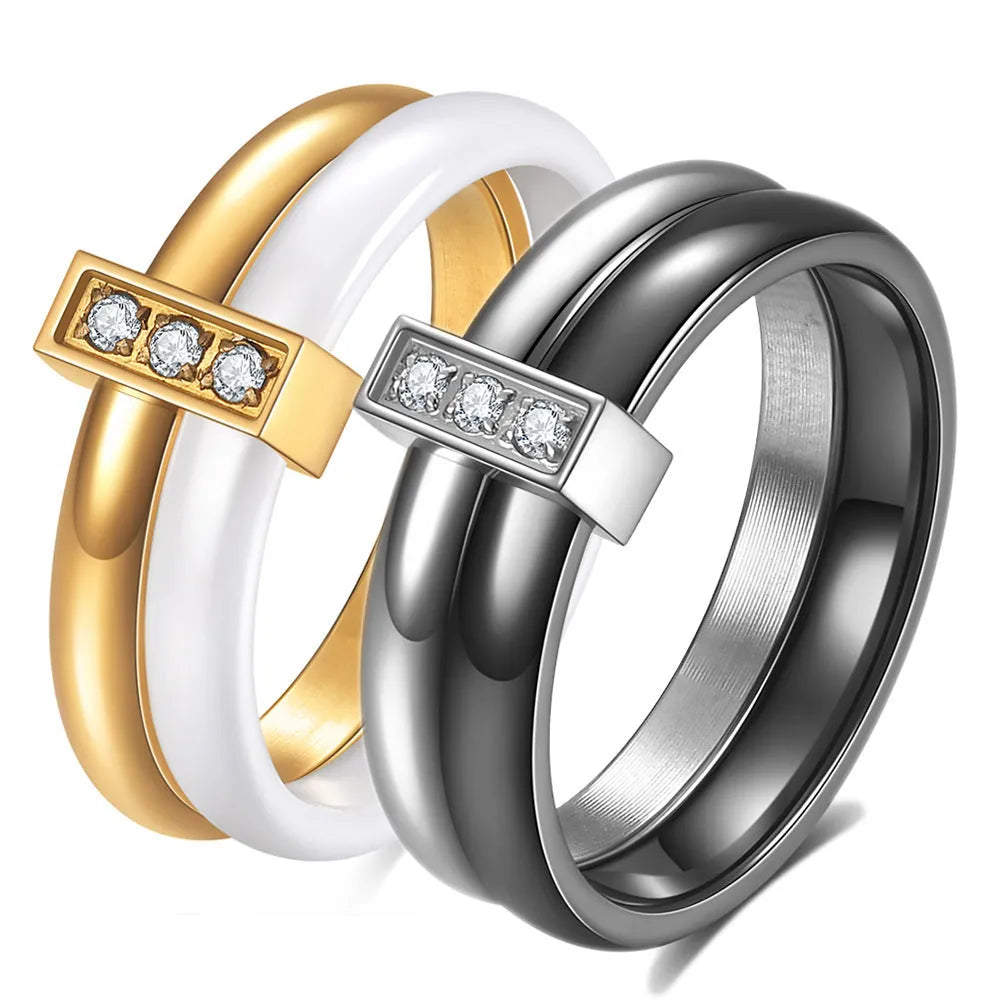 Steel black ceramic women's ring with glossy stitching and zirconium accents, geometric shape.
