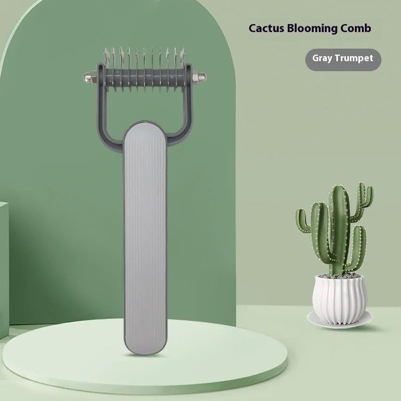 Green and grey dog grooming comb with stainless steel teeth for removing mats and tangles.