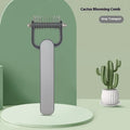 Green and grey dog grooming comb with stainless steel teeth for removing mats and tangles.