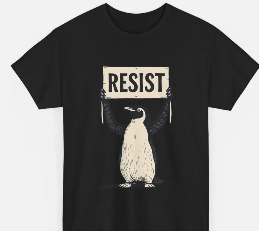 A loose-fitting black short-sleeved cotton t-shirt with a round neck on a hanger.