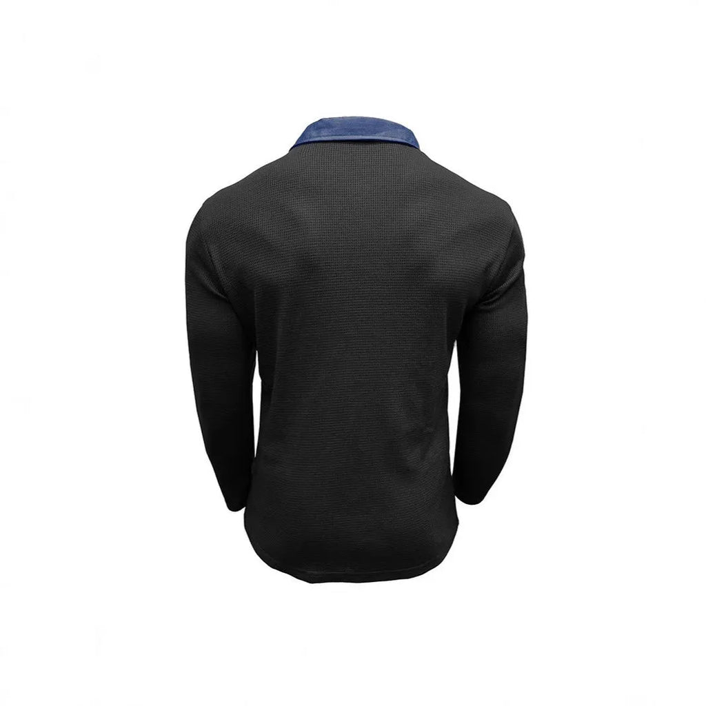 Man wearing a long-sleeved waffle-texture polo shirt in a solid colour with a loose, retro fit.