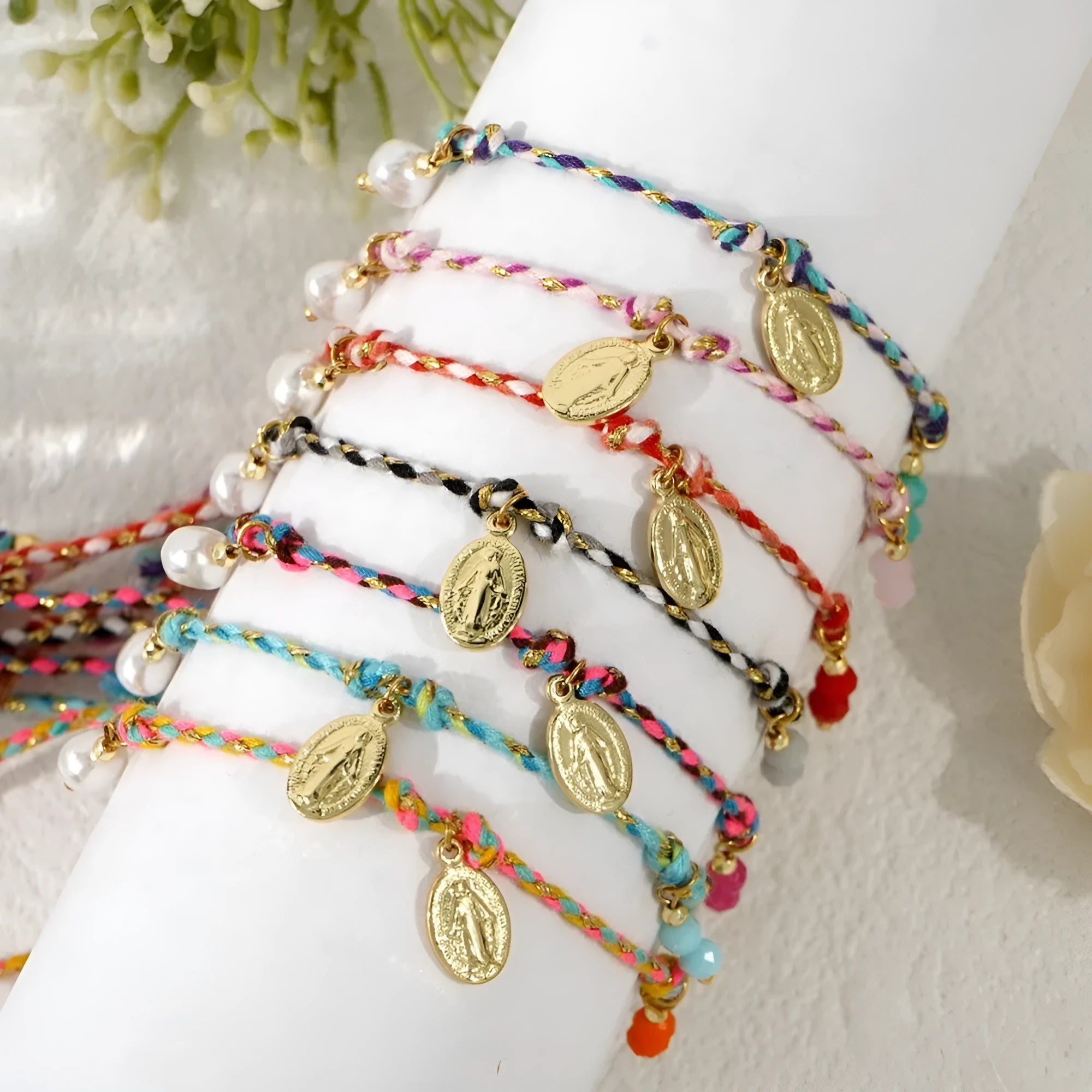 Close-up of a hand-woven colourful braided rope bracelet for women, showing textured ethnic style.