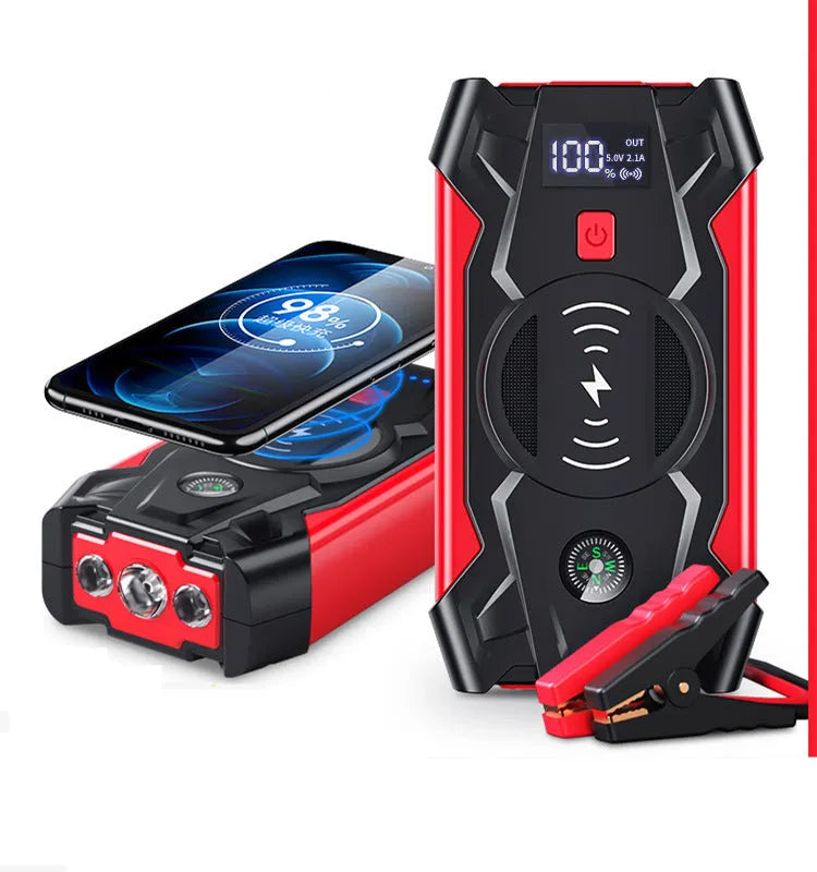 Red car emergency jump starter with digital display and battery clips showing 39800A peak current