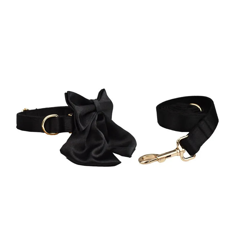Cloth dog collar and leash set with chest strap, coordinating bow, and dog vest in multiple sizes.