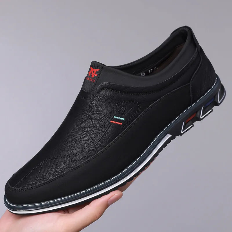 Men's casual low-top leather shoes with a fabric upper, leather toe cap, and rubber sole.