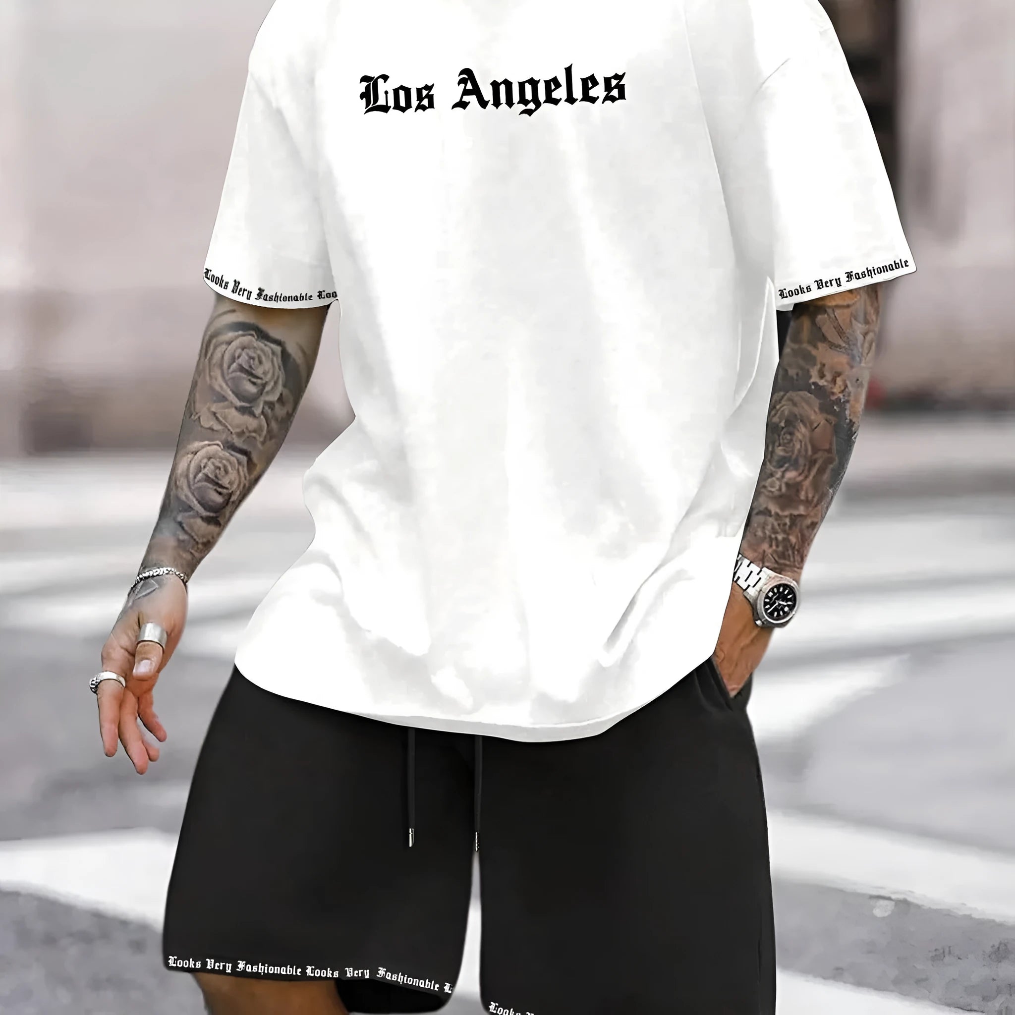 Men's grey sports short sleeve top and matching shorts set on hanger