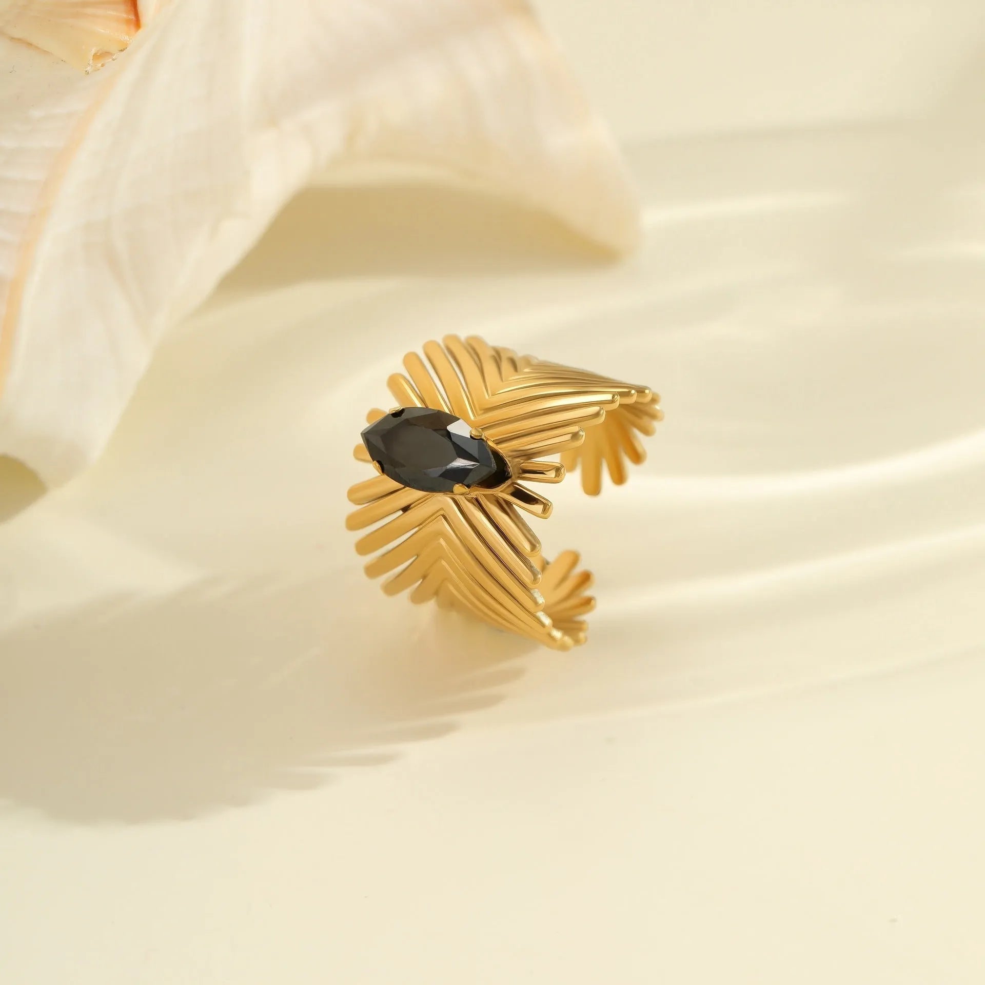Geometric titanium steel ring with inlaid zircon stones showing open mouth adjustable design.