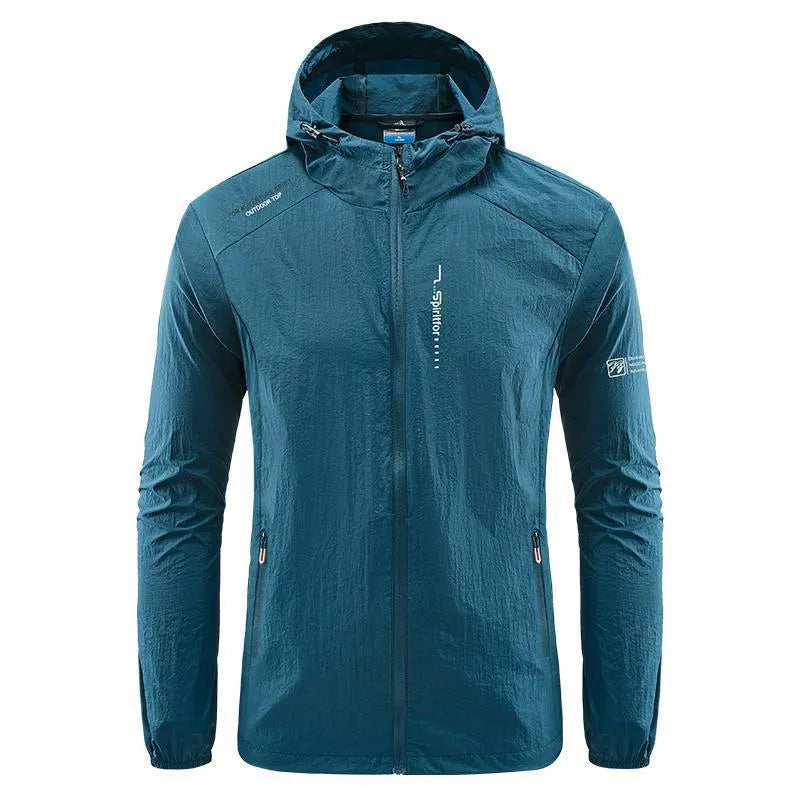 Man wearing a light grey loose-fitting hooded nylon summer jacket for sun protection.