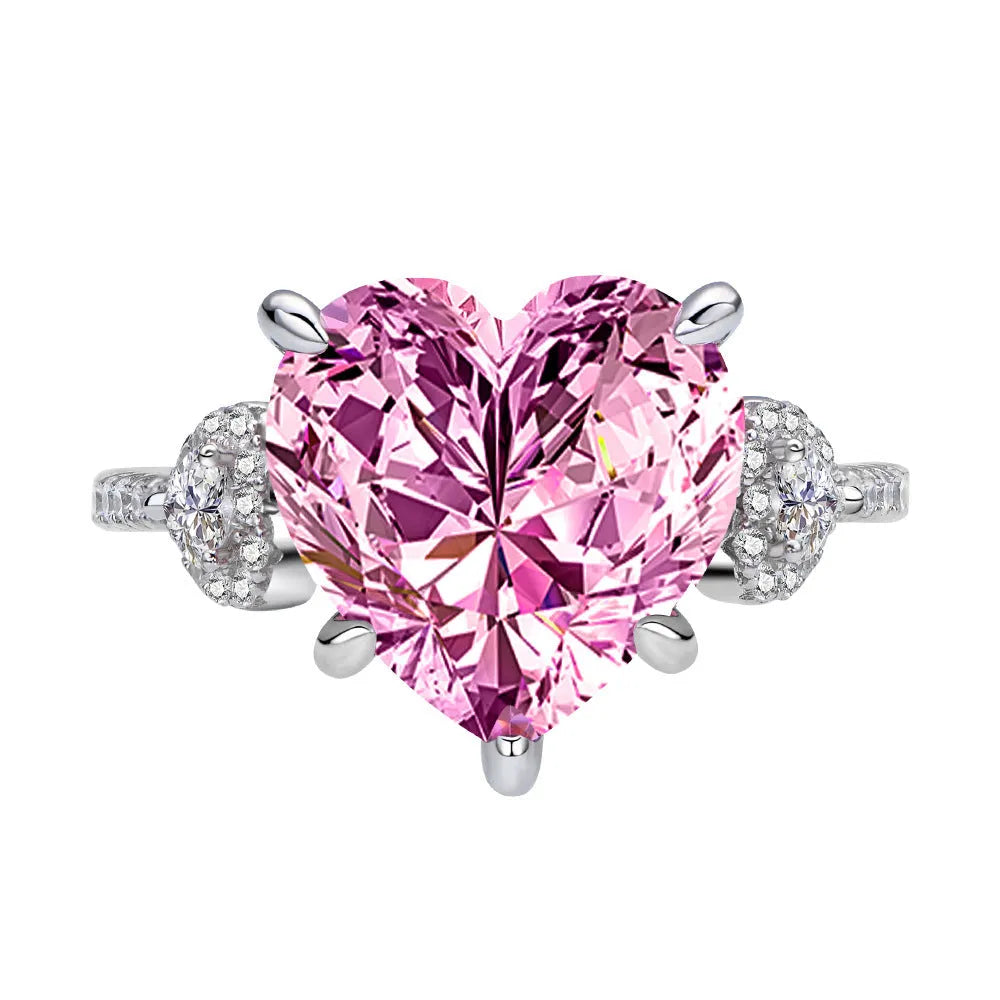 Heart-shaped diamond ring on white background, 925 silver band, open inlay setting
