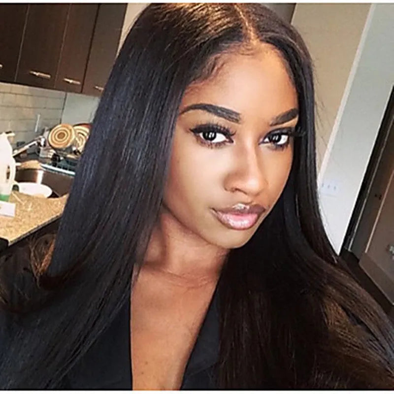 Long straight black synthetic wig with centre part and bangs on a model