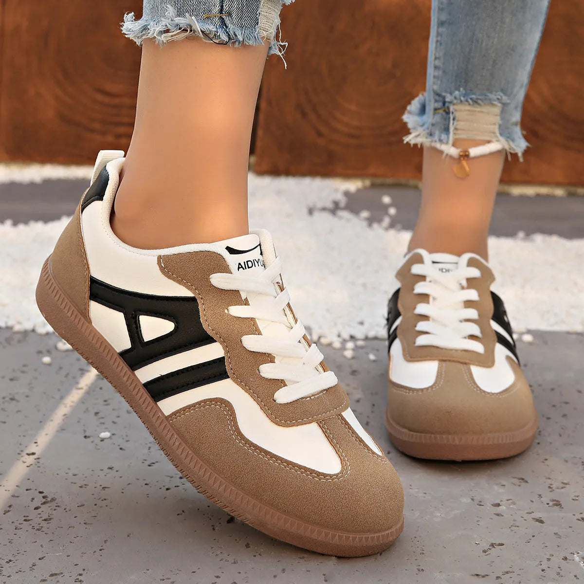 Women's retro grey jogging shoes with colour matching details, lace-up front, and a low platform heel.