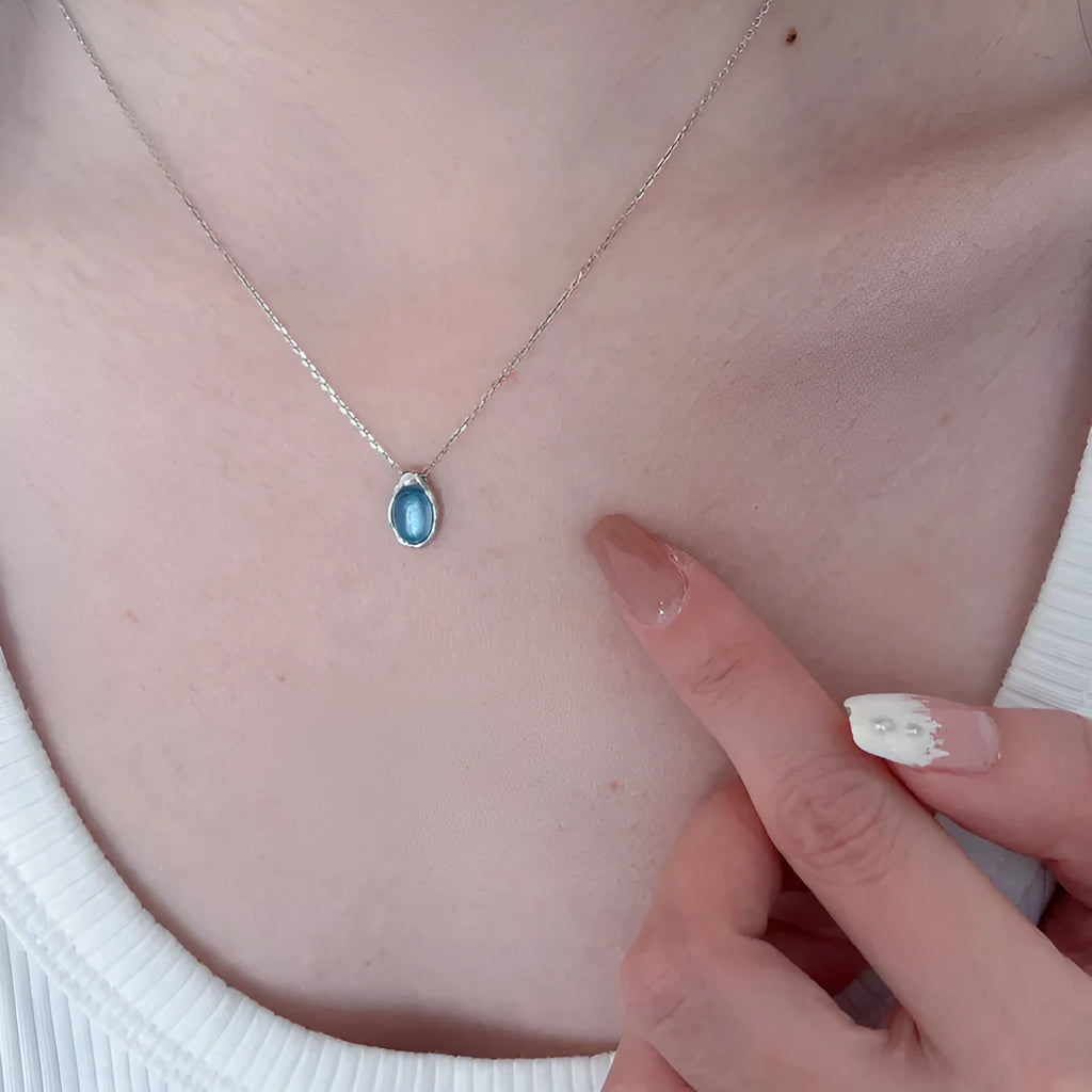 Navy blue water drop pendant necklace with geometric copper pendant on adjustable chain