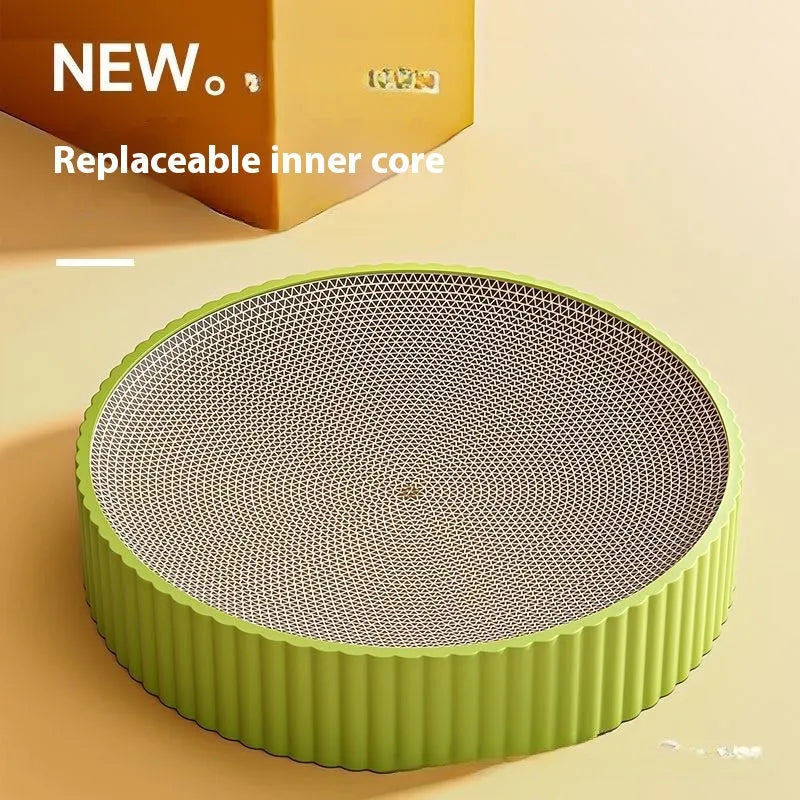 Green and white round cat scratching board with corrugated cardboard surface measuring 55cm across