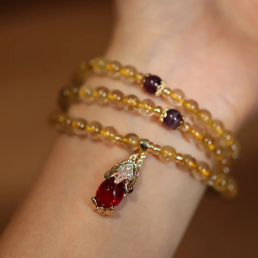 Natural Brazil gold rutilated quartz bracelet with Chinese style design featuring hanging chopsticks and three circles pattern