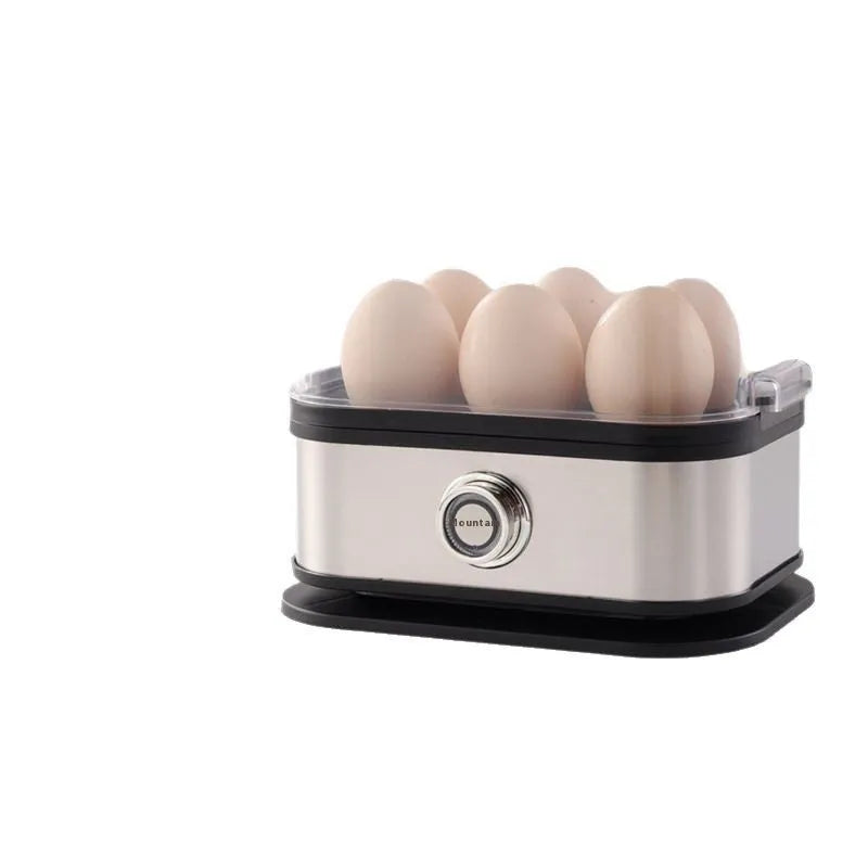 Black portable stainless steel egg boiler with carrying belt on a table.