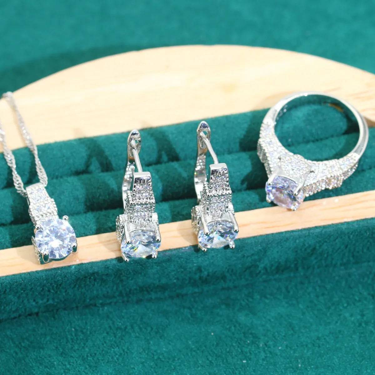 Four-piece bridal zircon jewellery set with necklace, earrings, bracelet and ring in water wave chain design