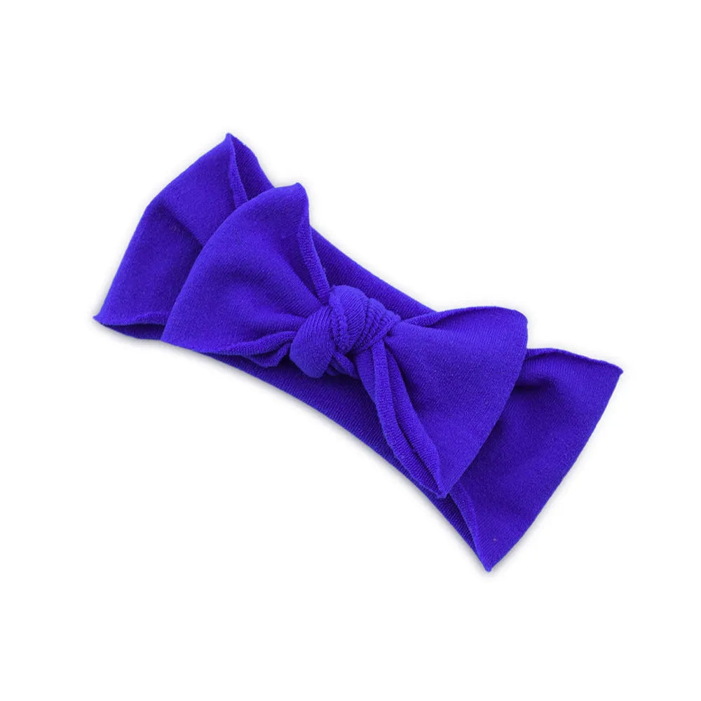 Solid colour knotted cloth headband for baby girls with bowknot design, available in 37 colours