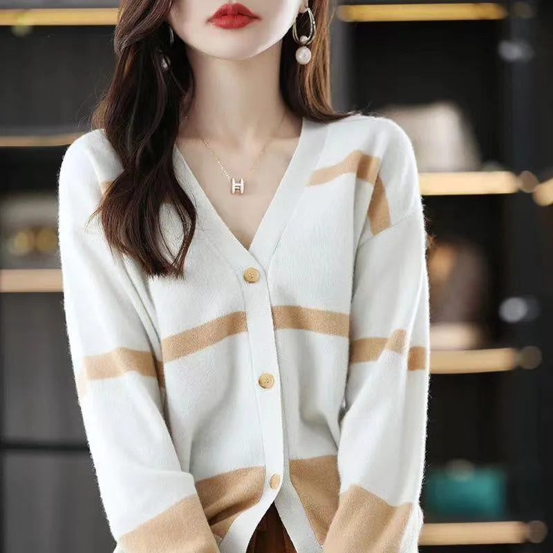 Women's striped V-neck knitted cardigan with 3D patterned sleeves and button front in a slim fit.