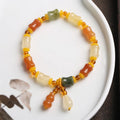 Jinsi Jade bracelet with small bone beads showing auspicious patterns and geometric design