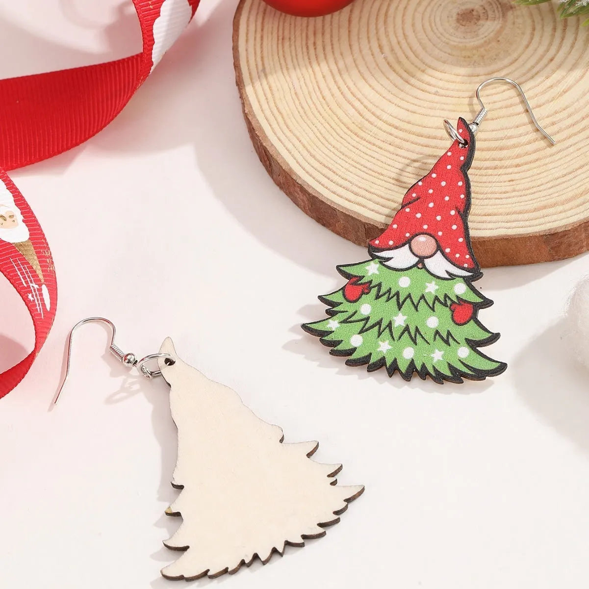 Printed wooden Christmas earrings with geometric Santa Claus designs in red and green