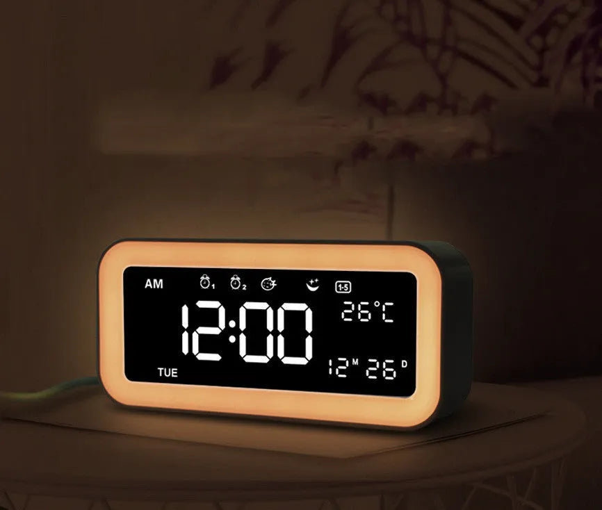 Rectangular digital alarm clock with LED atmospheric lighting and music function in blue colour option