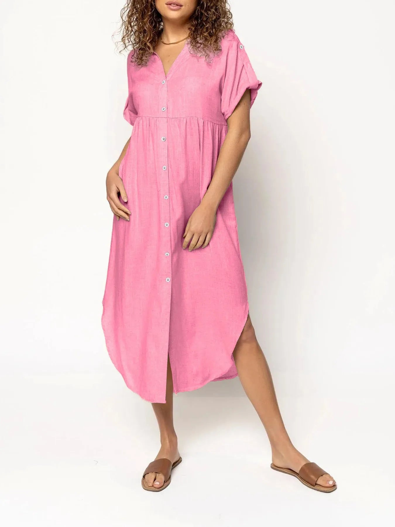 Loose-fitting casual solid colour button dress in a mid-length style on a hanger.