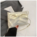 Women's black underarm bag in horizontal square shape showing sandwich pocket design and crossbody strap