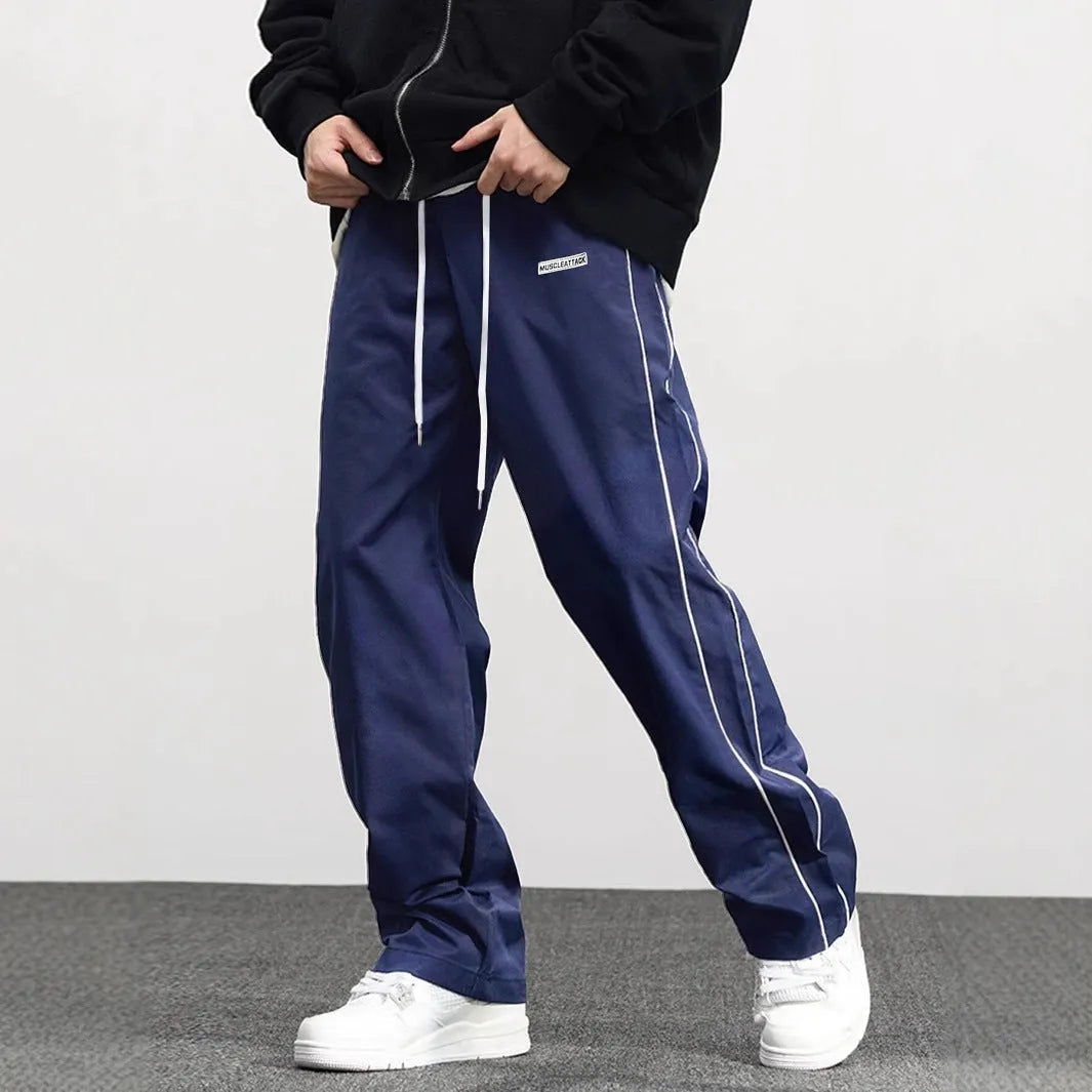 Men's loose fit polyester cargo trousers with side pockets in black, navy blue, and dark green