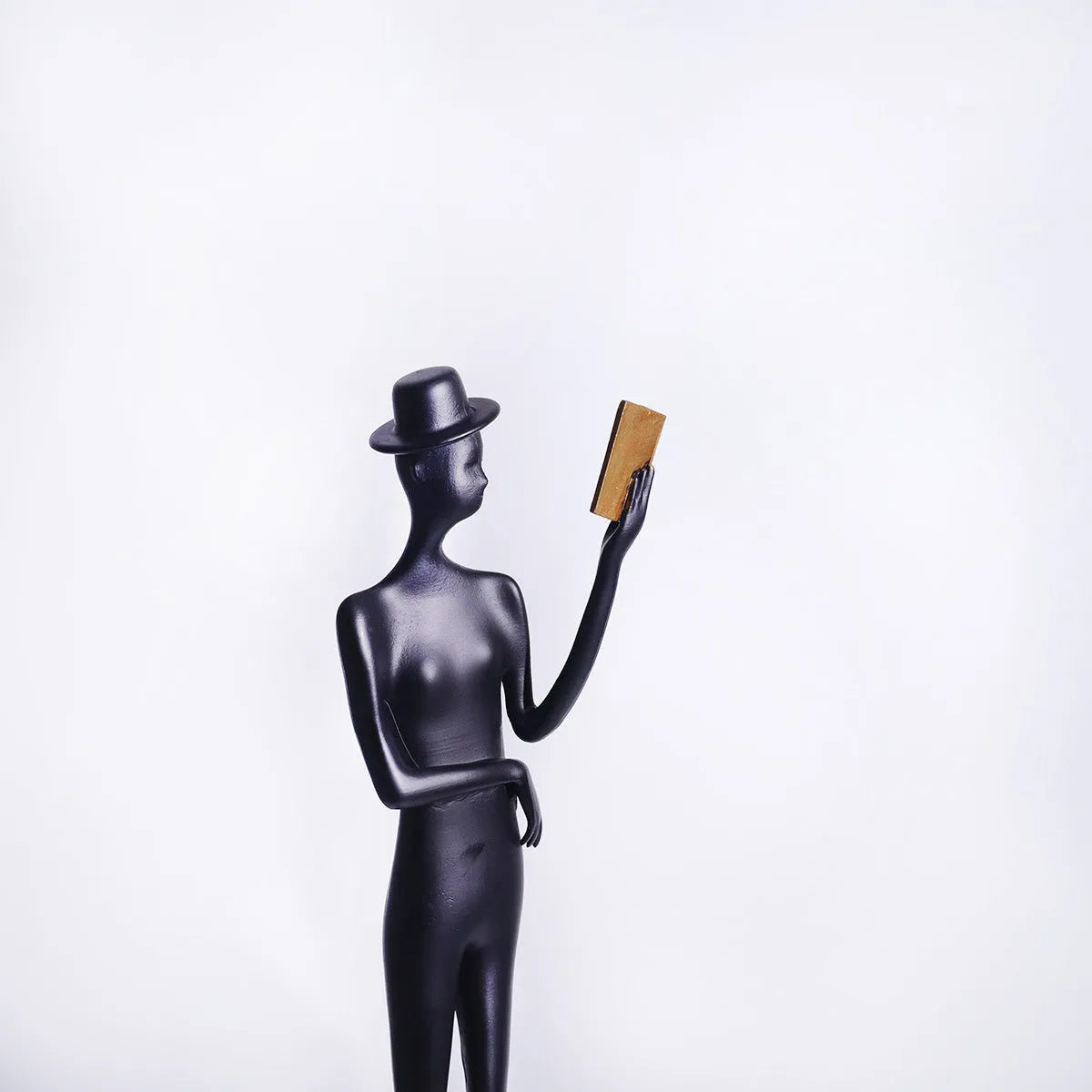 Black cast aluminium reading woman desktop sculpture modern design 51cm tall