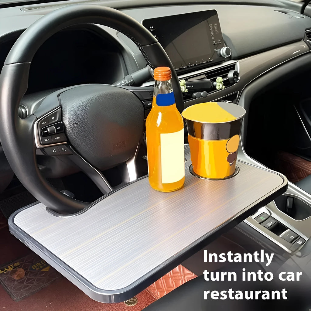 Black ABS plastic car steering wheel laptop stand with foldable cup holder on a grey steering wheel