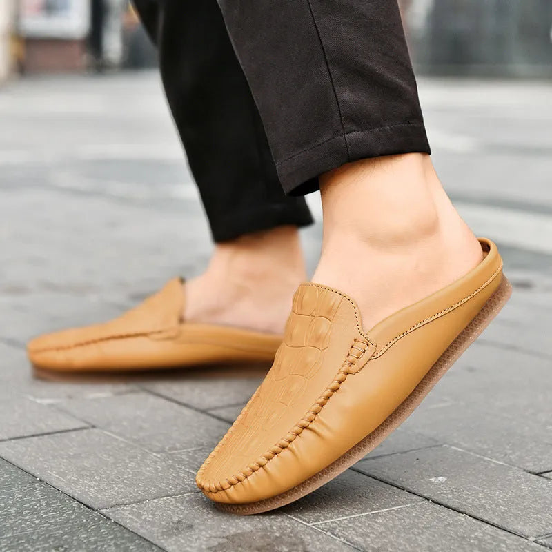Men's black breathable semi-slippers with an artificial PU upper and rubber sole, shown from the side.