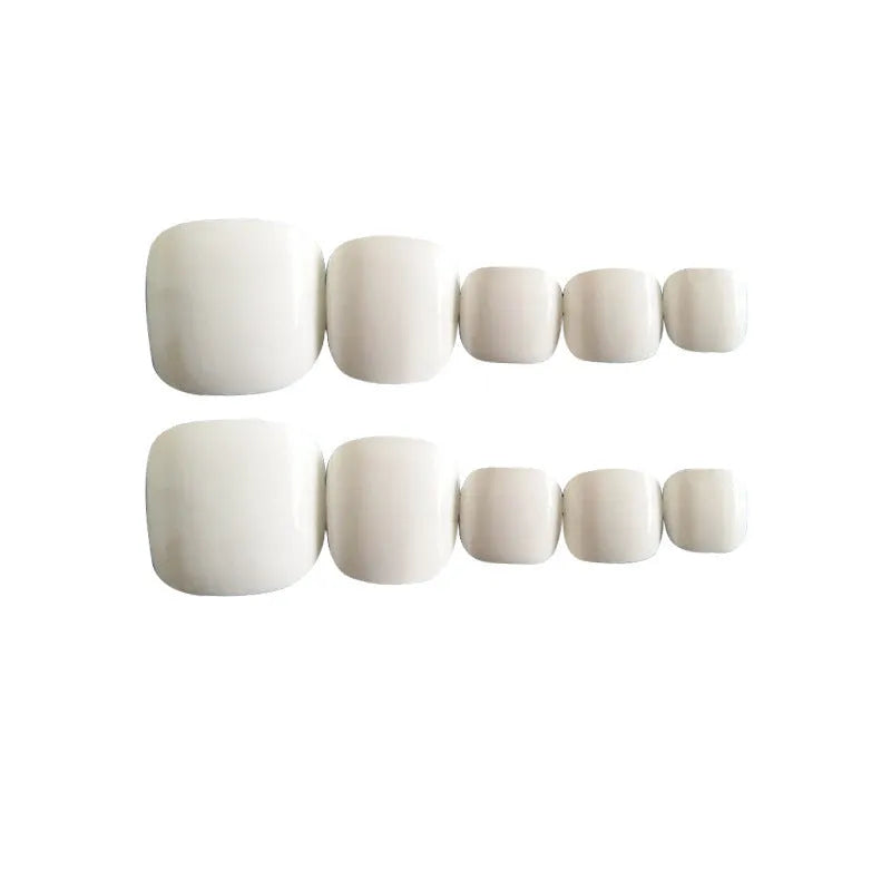 White false nails with starry sky pattern detail, includes glue for application