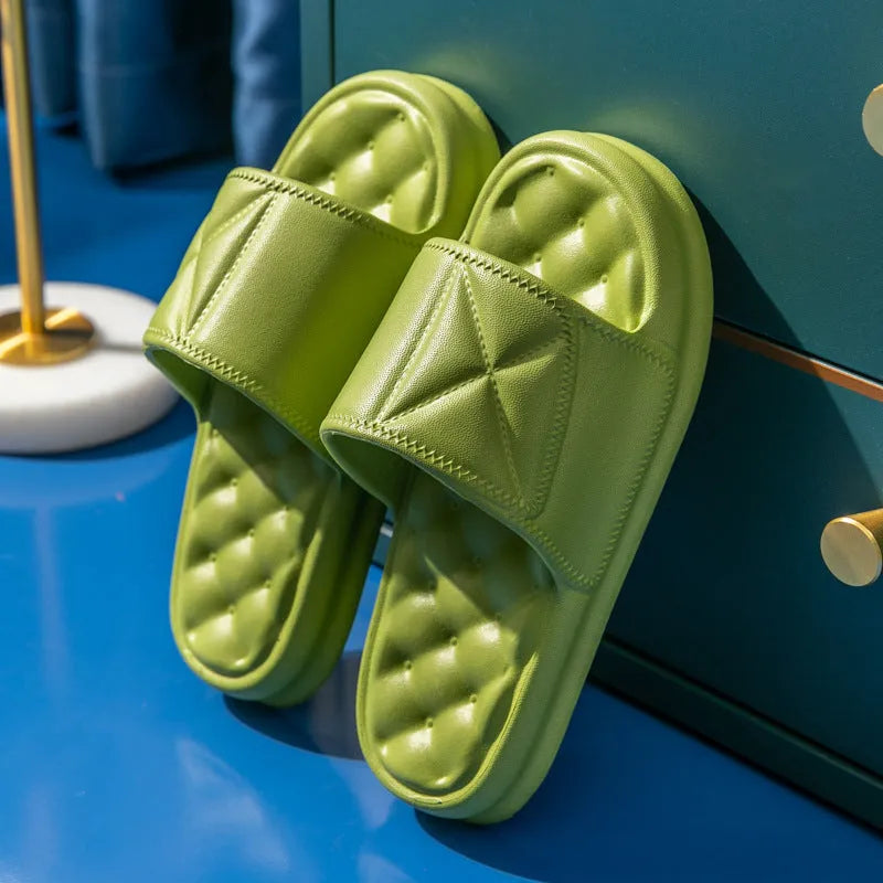 A pair of soft EVA bathroom slippers with a thick non-slip sole, shown in available colours.
