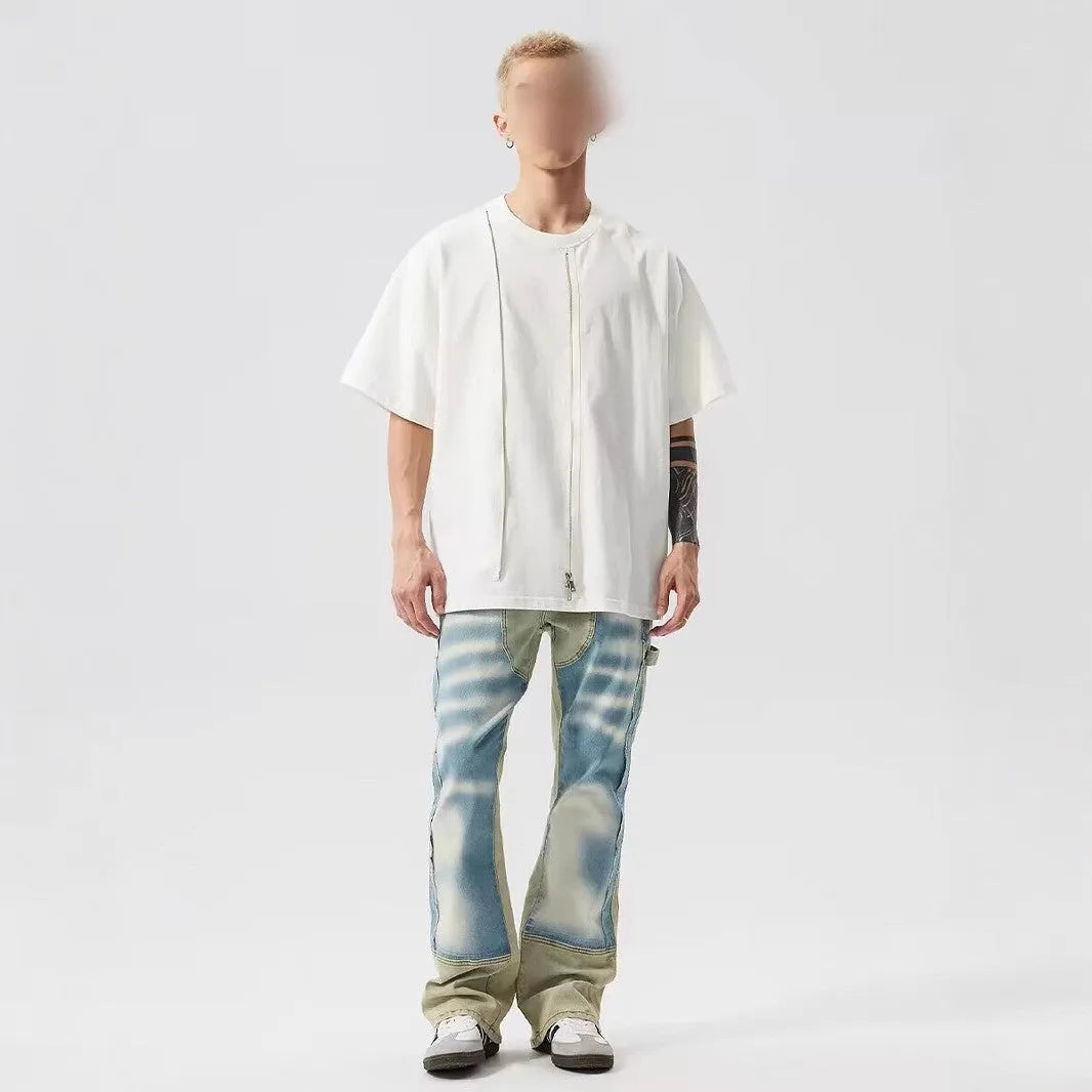 Yellow and blue retro patchwork distressed jeans with splash-ink design details on mid-waist denim trousers